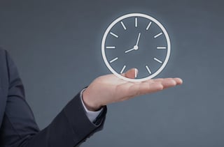 Woman holding holographic analog clock in her hand