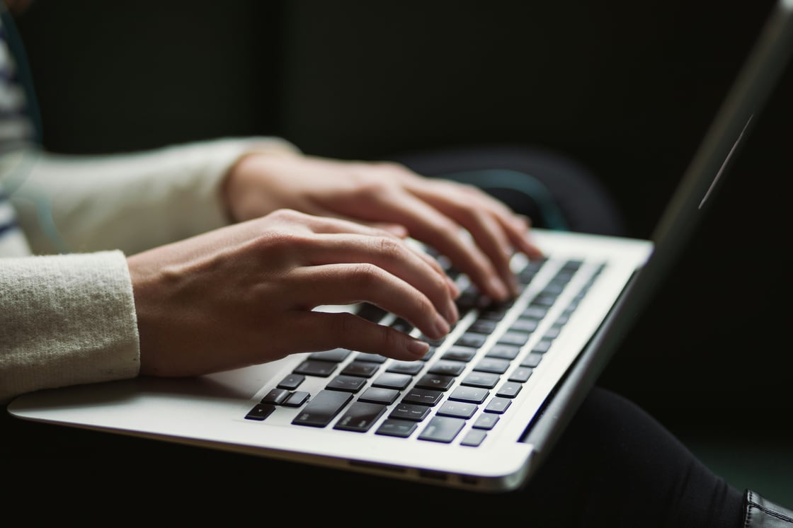 woman typing on a keyboard : kaitlyn-baker-vZJdYl5JVXY-unsplash